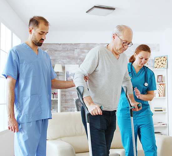 Caregiver holding an older adult's hand